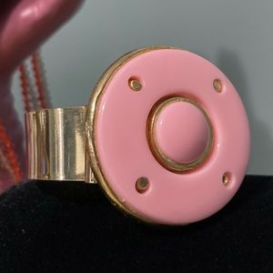 Pink Large Disk Atop 1" wide gold-tone bangle bracelet